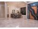 Sophisticated dining area features modern lighting and large window and an open floor plan at 15701 E Greystone Dr, Fountain Hills, AZ 85268