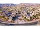 Aerial view of a residential area with houses and mountain views at 15913 S 11Th Way, Phoenix, AZ 85048