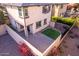 Elevated view of a home's backyard with artificial turf and a patio at 15913 S 11Th Way, Phoenix, AZ 85048