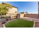 Landscaped backyard with artificial turf and a paved patio at 15913 S 11Th Way, Phoenix, AZ 85048