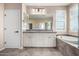 Bathroom boasts double vanity, a bathtub and shower at 15913 S 11Th Way, Phoenix, AZ 85048