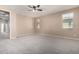 Spacious bedroom with carpeted floor and ceiling fan at 15913 S 11Th Way, Phoenix, AZ 85048