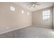 Well-lit bedroom with carpet and multiple windows at 15913 S 11Th Way, Phoenix, AZ 85048