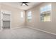 Bright bedroom with carpet, ceiling fan, and walk-in closet at 15913 S 11Th Way, Phoenix, AZ 85048