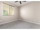 Simple bedroom with carpet, window blinds, and ceiling fan at 15913 S 11Th Way, Phoenix, AZ 85048