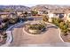 Entrance to the Rosewood Village community with gated entry and landscaping at 15913 S 11Th Way, Phoenix, AZ 85048