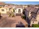 An aerial view of a two story home's exterior, showcasing a garage and landscaping at 15913 S 11Th Way, Phoenix, AZ 85048