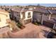 An aerial view of a two story home's exterior, showcasing a garage and landscaping at 15913 S 11Th Way, Phoenix, AZ 85048