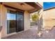 Covered patio with sliding glass door, brick flooring, and small yard at 15913 S 11Th Way, Phoenix, AZ 85048