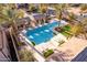 Community pool with lounge chairs and covered seating areas at 15913 S 11Th Way, Phoenix, AZ 85048