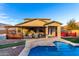 Home's backyard with patio furniture and a pool at 1625 W Cool Water Way, San Tan Valley, AZ 85144