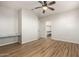 Bright bedroom featuring wood-look floors and ceiling fan at 1625 W Cool Water Way, San Tan Valley, AZ 85144