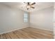 Spacious bedroom with wood-look floors and a window at 1625 W Cool Water Way, San Tan Valley, AZ 85144