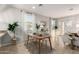 Bright dining area with a wooden table and modern chairs near sliding doors at 1625 W Cool Water Way, San Tan Valley, AZ 85144