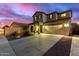 Two-story house with attached garage at 1625 W Cool Water Way, San Tan Valley, AZ 85144