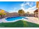 Expansive backyard featuring a refreshing pool and grassy area at 1625 W Cool Water Way, San Tan Valley, AZ 85144