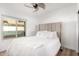 Spacious bedroom with a plush bed and large window at 16414 N 48Th Way, Scottsdale, AZ 85254