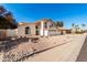 Two-story home with desert landscaping and a two-car garage at 16414 N 48Th Way, Scottsdale, AZ 85254