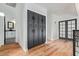 Modern hallway with dark cabinetry and hardwood floors at 16414 N 48Th Way, Scottsdale, AZ 85254