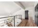 Modern hallway with lofted ceilings and black metal railings at 16414 N 48Th Way, Scottsdale, AZ 85254