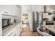 Modern kitchen with stainless steel appliances and white cabinets at 16414 N 48Th Way, Scottsdale, AZ 85254