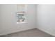 Simple bedroom with window, neutral walls and carpet at 17741 W Mission Ln, Waddell, AZ 85355