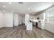 Open concept kitchen with island and stainless steel appliances at 17741 W Mission Ln, Waddell, AZ 85355