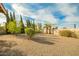 Spacious backyard with gravel landscaping and mature trees at 18449 N 46Th Ave, Glendale, AZ 85308