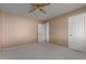 Bedroom with ceiling fan and door to hallway at 18449 N 46Th Ave, Glendale, AZ 85308