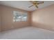 Bedroom with ceiling fan, window, and ample closet space at 18449 N 46Th Ave, Glendale, AZ 85308