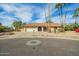 House exterior with a two-car garage and palm trees at 18449 N 46Th Ave, Glendale, AZ 85308