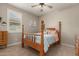 Charming bedroom with wood post bed frame at 18610 W Alice Ave, Waddell, AZ 85355