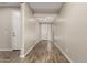 Bright and spacious entryway with wood-look flooring at 18610 W Alice Ave, Waddell, AZ 85355