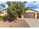 Single story home with attractive curb appeal and landscaped yard at 18610 W Alice Ave, Waddell, AZ 85355