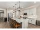 Bright and spacious kitchen with white cabinets and large island at 18610 W Alice Ave, Waddell, AZ 85355