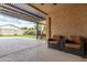 Relaxing patio with seating area and pergola at 18610 W Alice Ave, Waddell, AZ 85355