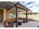 Comfortable patio with seating and fire pit at 18610 W Alice Ave, Waddell, AZ 85355