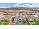 Overhead view of a home's backyard featuring a pool, trampoline, and patio in a well-maintained neighborhood at 20456 E Camina Buena Vis, Queen Creek, AZ 85142