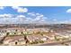 Wide aerial shot of the community showing numerous single-Gathering homes in a planned neighborhood at 20456 E Camina Buena Vis, Queen Creek, AZ 85142