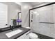 Bathroom showcasing modern fixtures, a shower with white tile and glass doors, and white cabinets at 20456 E Camina Buena Vis, Queen Creek, AZ 85142