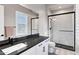 Modern bathroom featuring updated countertops, and a shower with glass doors at 20456 E Camina Buena Vis, Queen Creek, AZ 85142