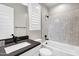 Contemporary bathroom features a white vanity, black fixtures, and hexagon tile shower at 20456 E Camina Buena Vis, Queen Creek, AZ 85142