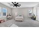 Bedroom featuring white trundle bed, desk, and plush beanbag at 20456 E Camina Buena Vis, Queen Creek, AZ 85142