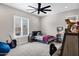 bedroom with ceiling fan, a window with blinds, and neutral color scheme at 20456 E Camina Buena Vis, Queen Creek, AZ 85142