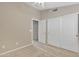 Simple bedroom with carpet and double door closet at 20902 N 36Th Pl, Phoenix, AZ 85050