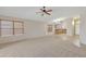 Spacious living room with tile and carpet, open to kitchen area at 20902 N 36Th Pl, Phoenix, AZ 85050