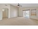 Open living room with neutral colors, carpet, and ceiling fan at 20902 N 36Th Pl, Phoenix, AZ 85050