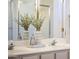 Bright bathroom featuring double sinks, neutral countertops and decor, and chrome fixtures at 23114 N 146Th Dr, Sun City West, AZ 85375