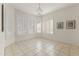 Cozy dining area with large windows and plantation shutters providing plenty of natural light at 23114 N 146Th Dr, Sun City West, AZ 85375