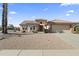 Charming single-story home featuring a tile roof, neutral stucco, desert landscaping, and an attached two-car garage at 23114 N 146Th Dr, Sun City West, AZ 85375